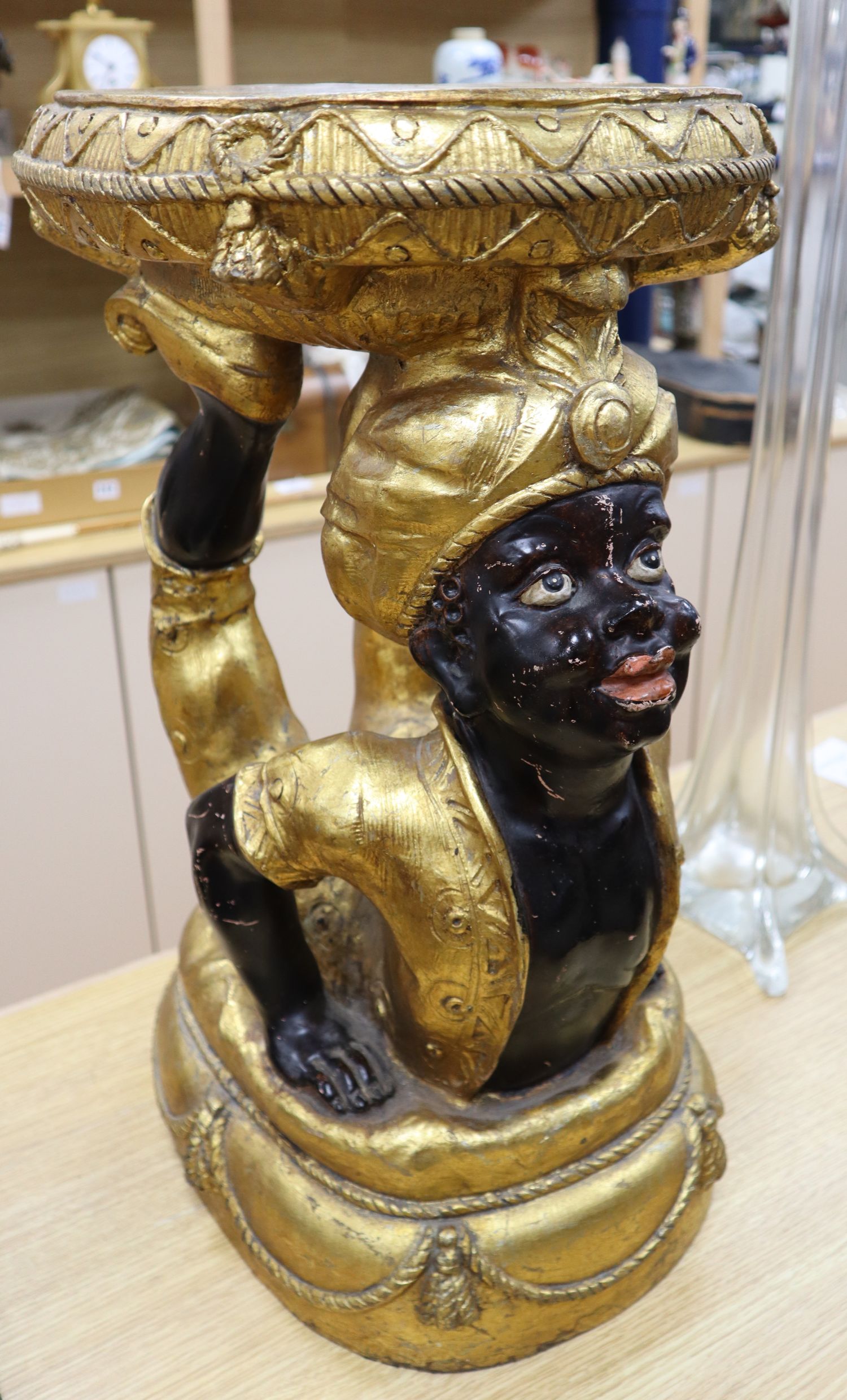 A composition blackamoor stool, height 57cm